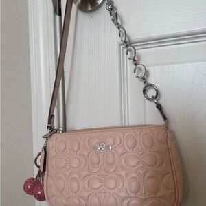 Coach Pink Nolita shoulder bag with cherry Charm and extender.